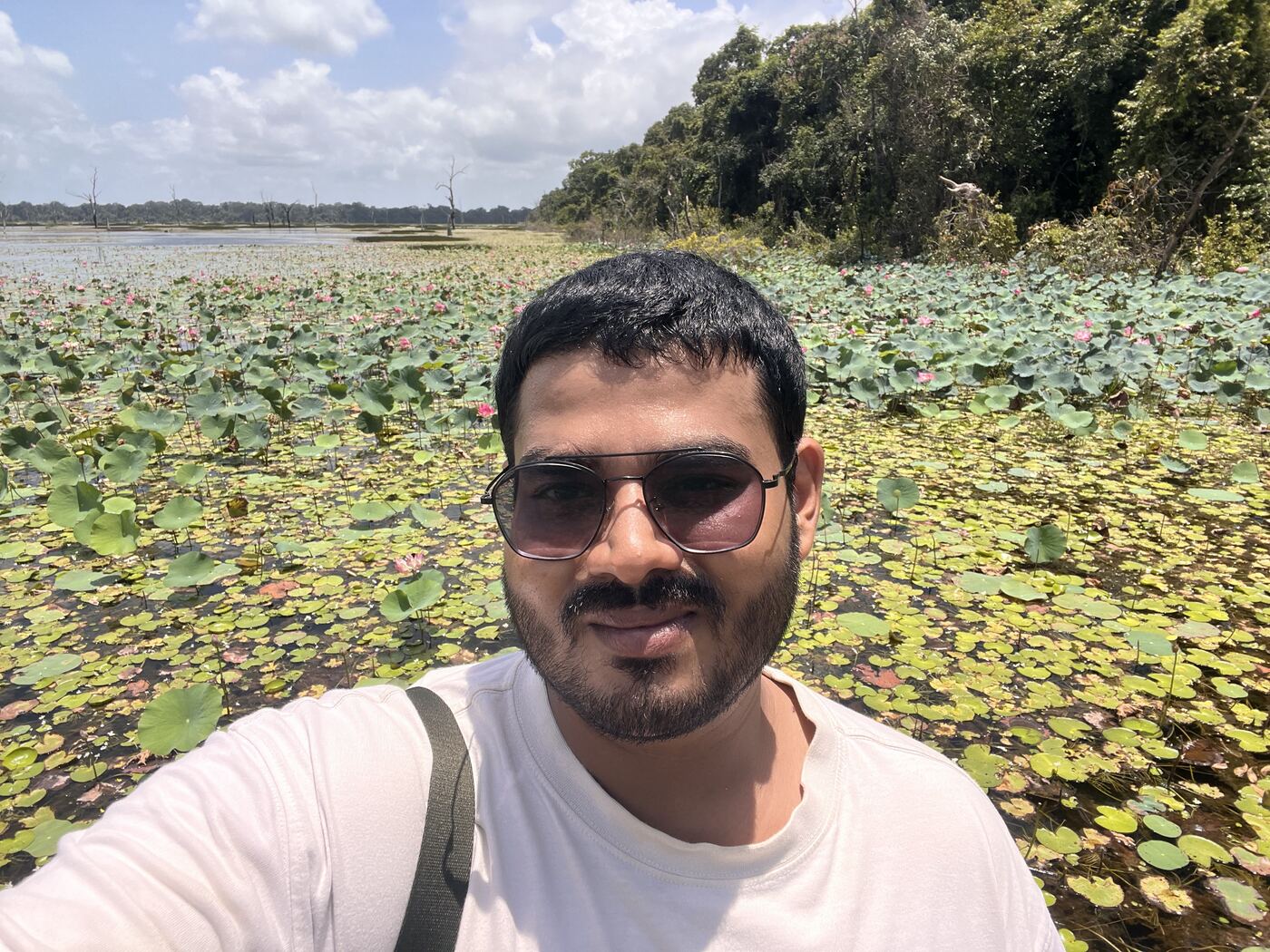 Selfie in front of a lake covered in lotus leaves